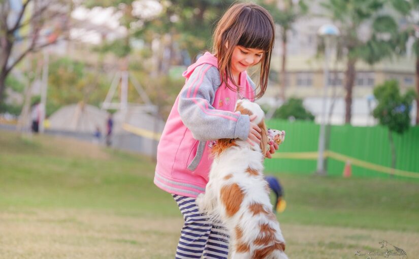 Portrait of a smiling young woman with dog